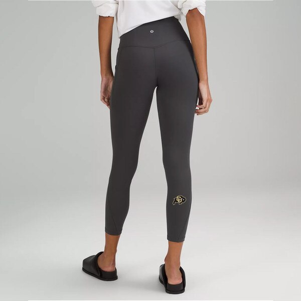 Dark grey high rise lululemon legging with the CU Buffalo logo on the right calf.